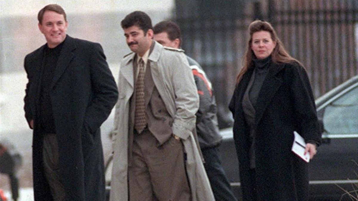Butch Davis and Pete Garcia walk into the Cleveland Browns facility after leaving the University of Miami on Jan. 29, 2001.