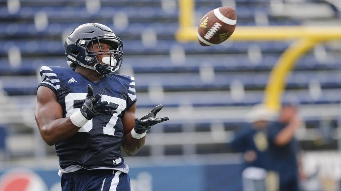 FIU Golden Panthers tight end Jonnu Smith on a reception during opening day of fall Florida International University football practice on Wed., Aug. 3, 2016.