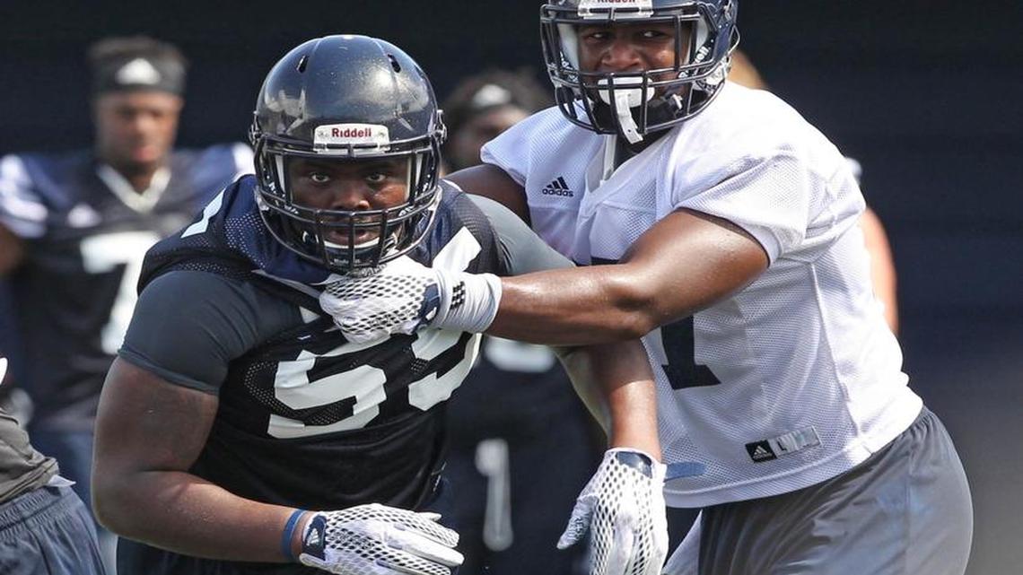 
FIU tight end Jonnu Smith (right) blocks defensive end Michael Wakefield during practice at FIU Stadium on Wednesday, Aug. 5, 2015.
