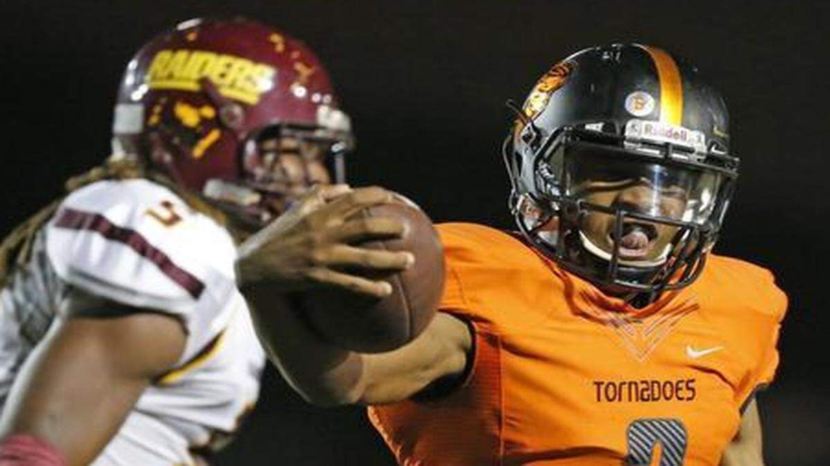 
Booker T. Washington’s Maurice Alexander scores in the second quarter against Glades Central at Traz Powell Stadium on Friday, Nov. 21, 2014.
