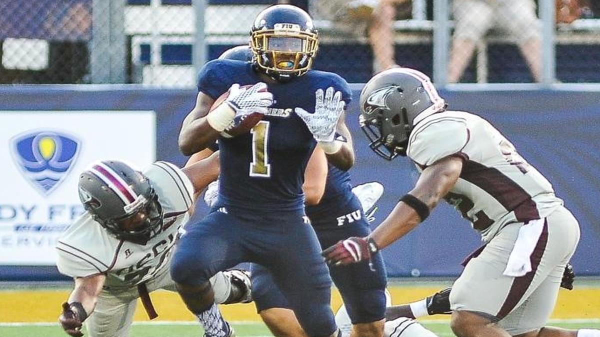 FIU cornerback Richard Leonard breaks a tackle against UNC Central on Saturday, Sept. 19, 2015 at FIU Stadium in Miami.