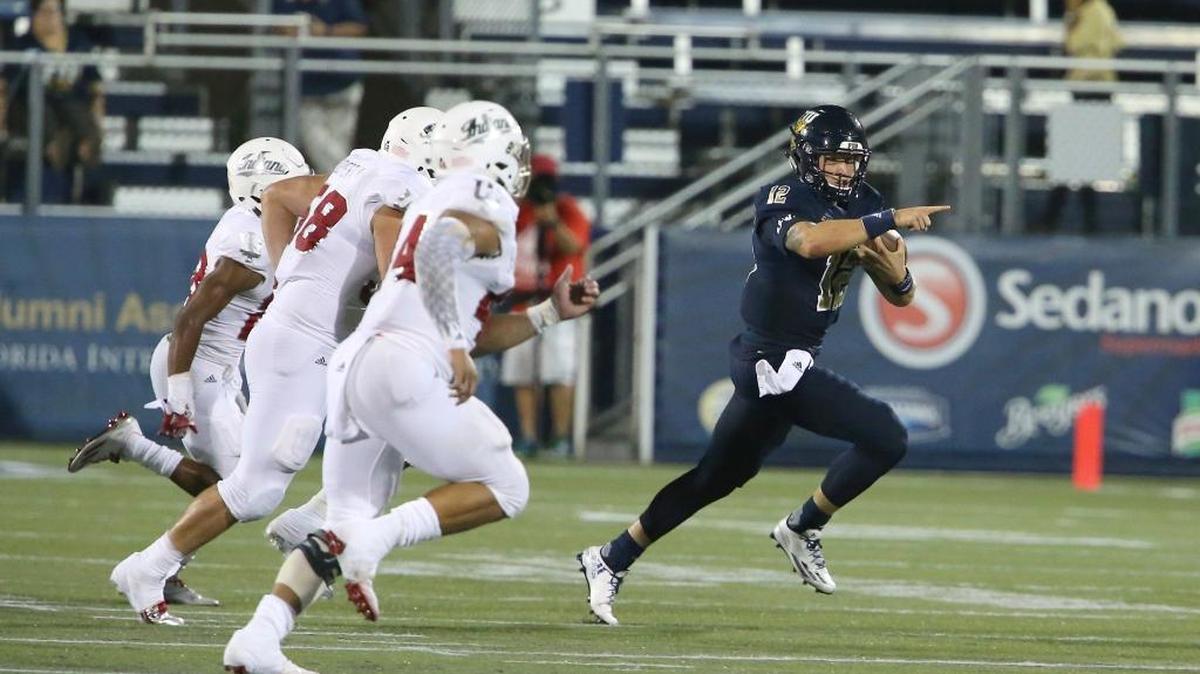 FIU quarterback Alex McGough scrambles against Indiana at a game in Miami last season.