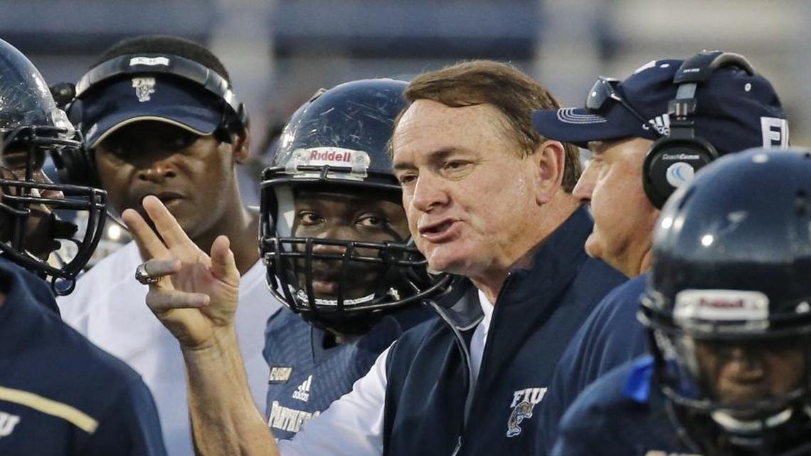 FIU head coach Butch Davis talks to players on the field during spring football game at FIU Stadium on Friday, April 7, 2017.