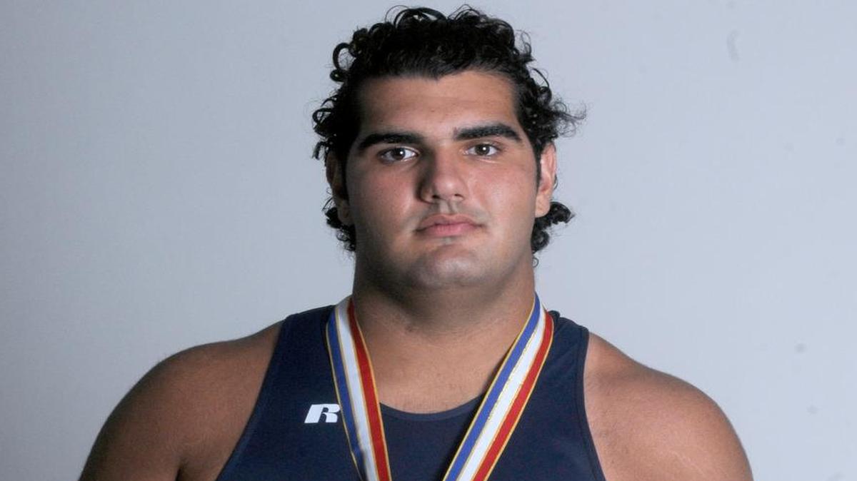 
FIU offensive lineman Michael Montero is pictured while competing in track and field for Columbus High. 
