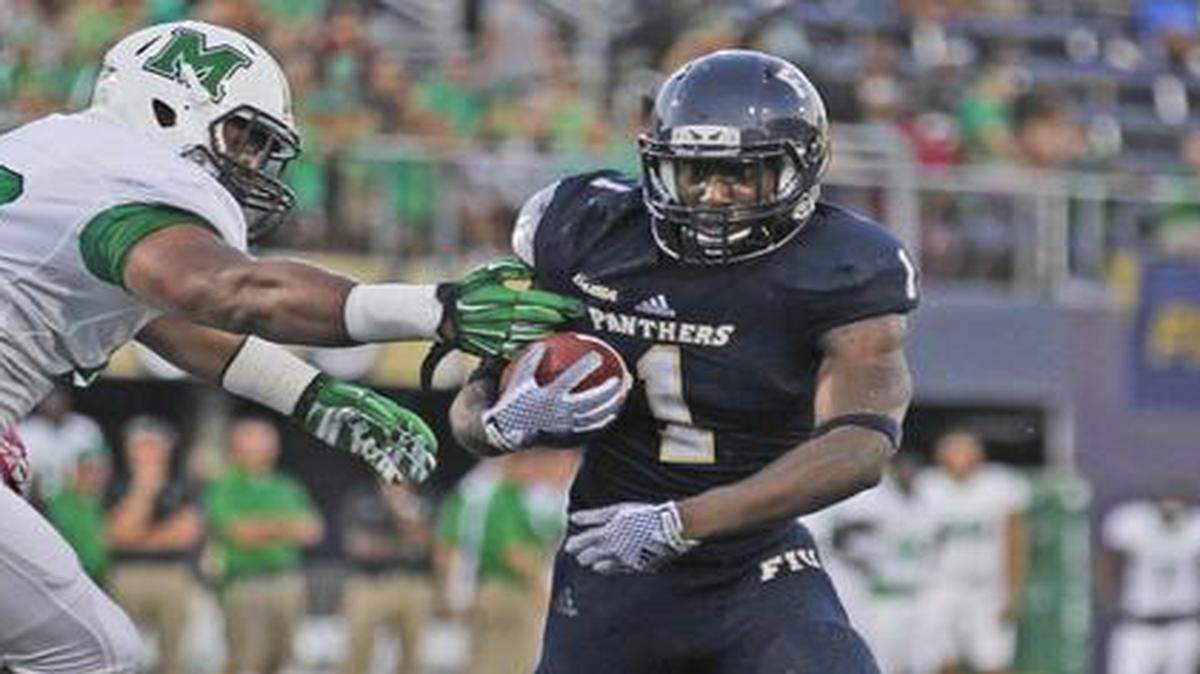 
FIU Panthers running back Alex Gardner (1) rushes to the one yard line as FIU hosts Marshall at Ocean Bank Stadium in Miami on Saturday, October 18, 2014.
