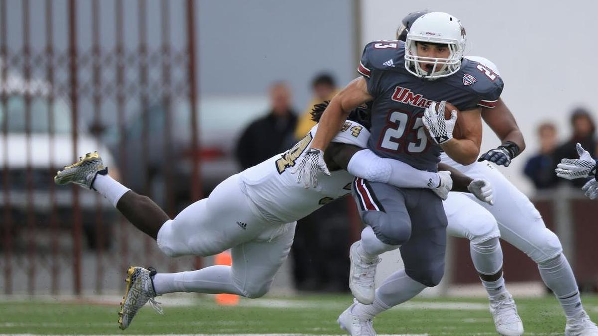 FIU linebacker Jephete Matilus wraps up UMass’ Andy Isabella during Saturday’s game. Matilus was replacing injured starter Treyvon Williams.