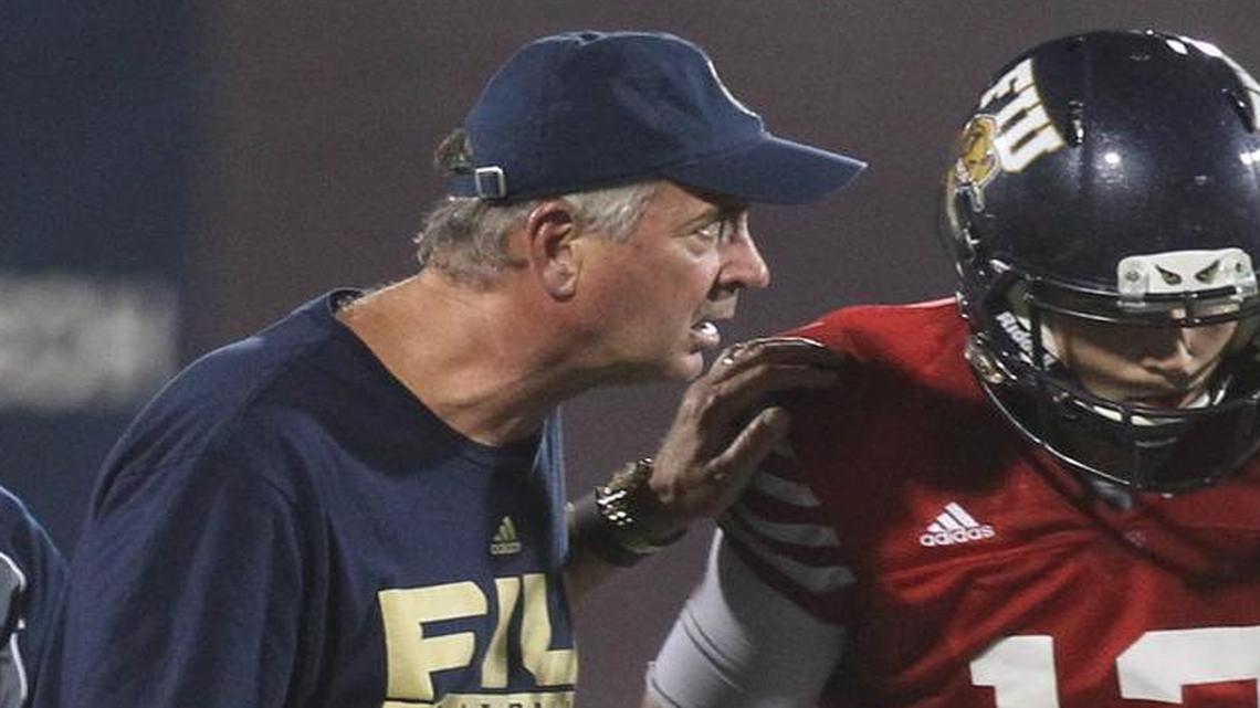 
Coach Ron Turner talks to quarterback Alex McGough during FIU’s spring football game Friday, April 17, 2015 at Ocean Bank Stadium.
