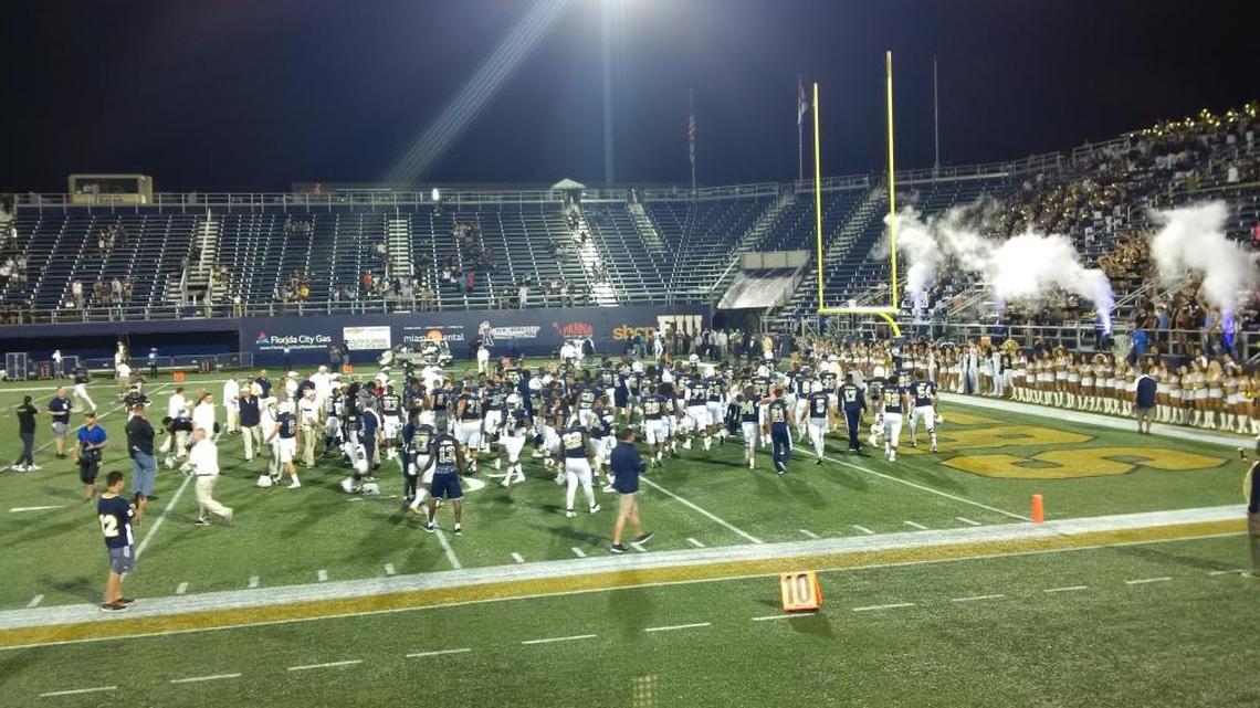 The FIU football team celebrates after its 14-7 win over UTSA Saturday night that made them bowl eligible at 6-2.