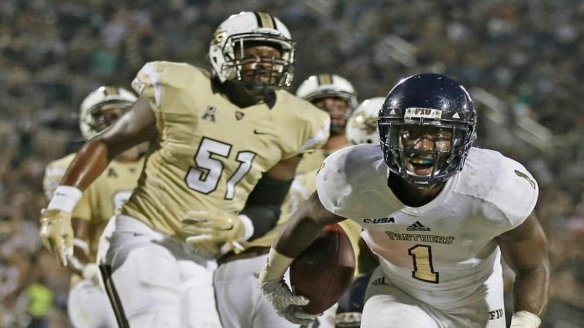 
FIU running back Alex Gardner scores in the third quarter against UCF in Orlando on Thursday, Sept. 3, 2015.
