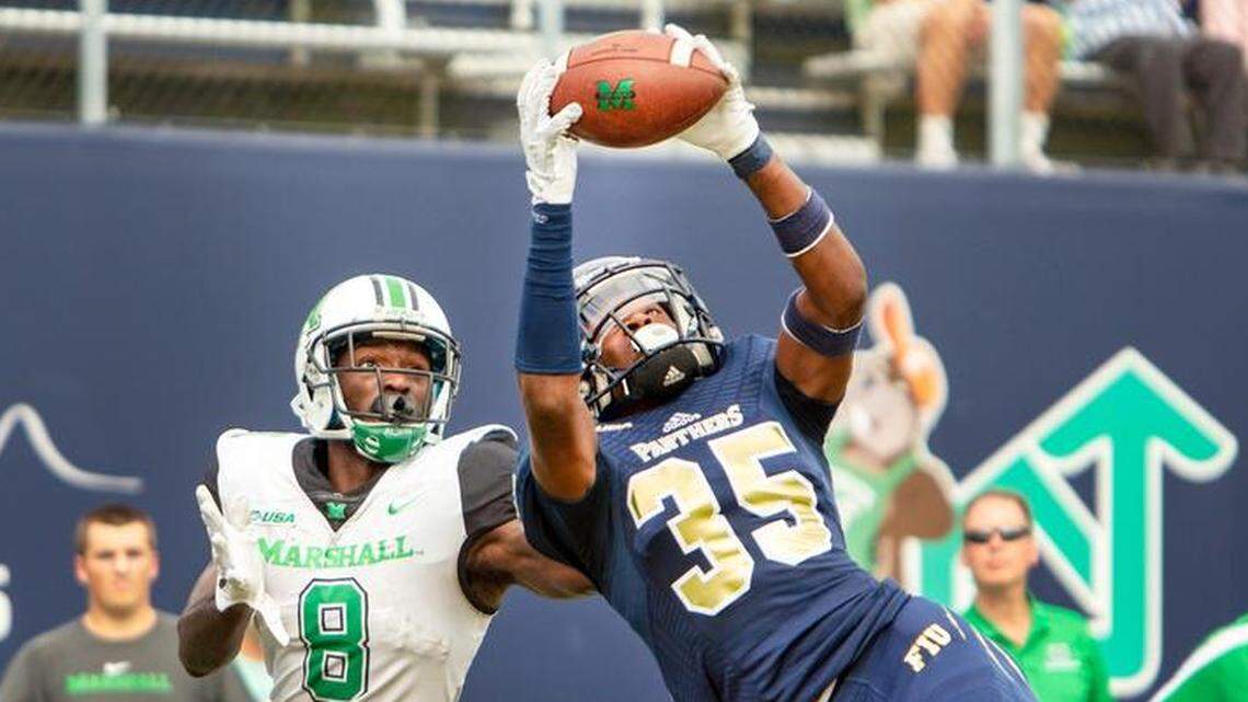 Florida International University cornerback Rishard Dames (35) intercepts the pass intended for Marshall University wide reciever Tyre Brady (8) during the second quarter against Marshall University Saturday, Nov. 24, 2018, at Riccardo Silva Stadium in Miami.