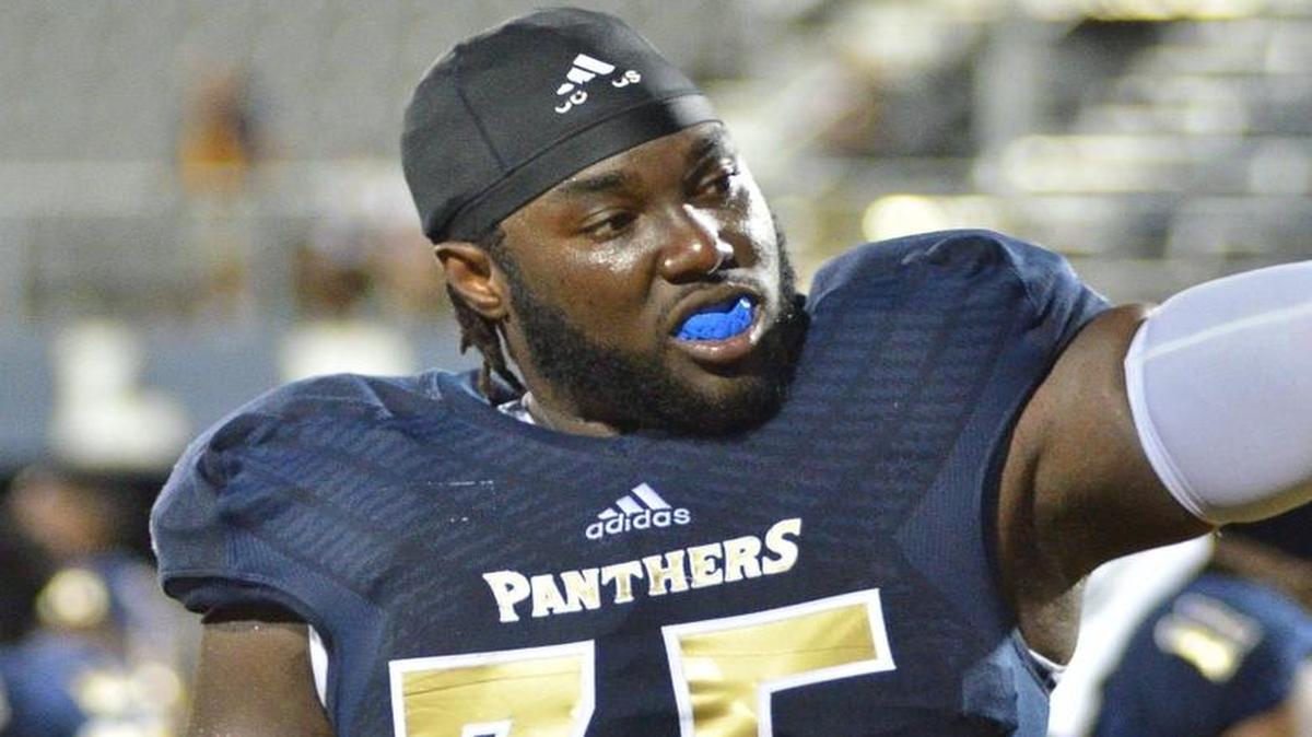 
FIU offensive tackle Edens Sineace holds his helmet during a victory against N.C. Central on Saturday, Sept. 19, 2015 at Ocean Bank Field at FIU Stadium in Miami. 
