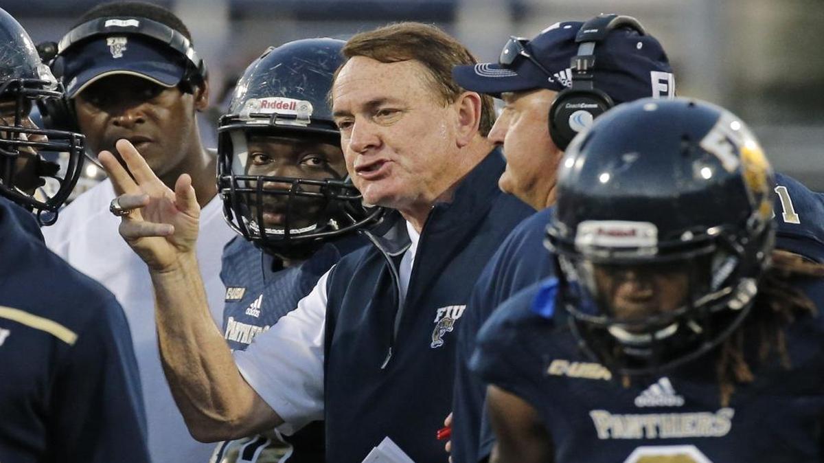 FIU head coach Butch Davis talks to players on the field during spring football game at FIU Stadium on Fri., April 7, 2017.