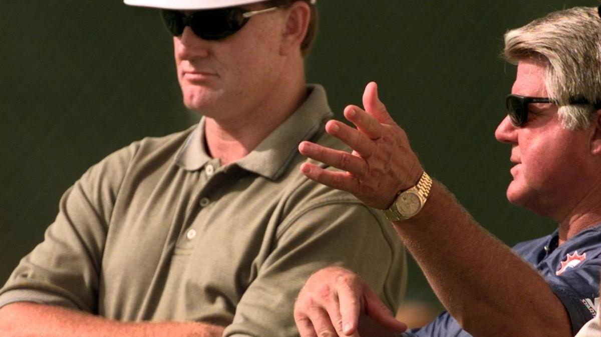 University of Miami Coach Butch Davis visits Dolphins camp and coach Jimmy Johnson during a practice in 1998.