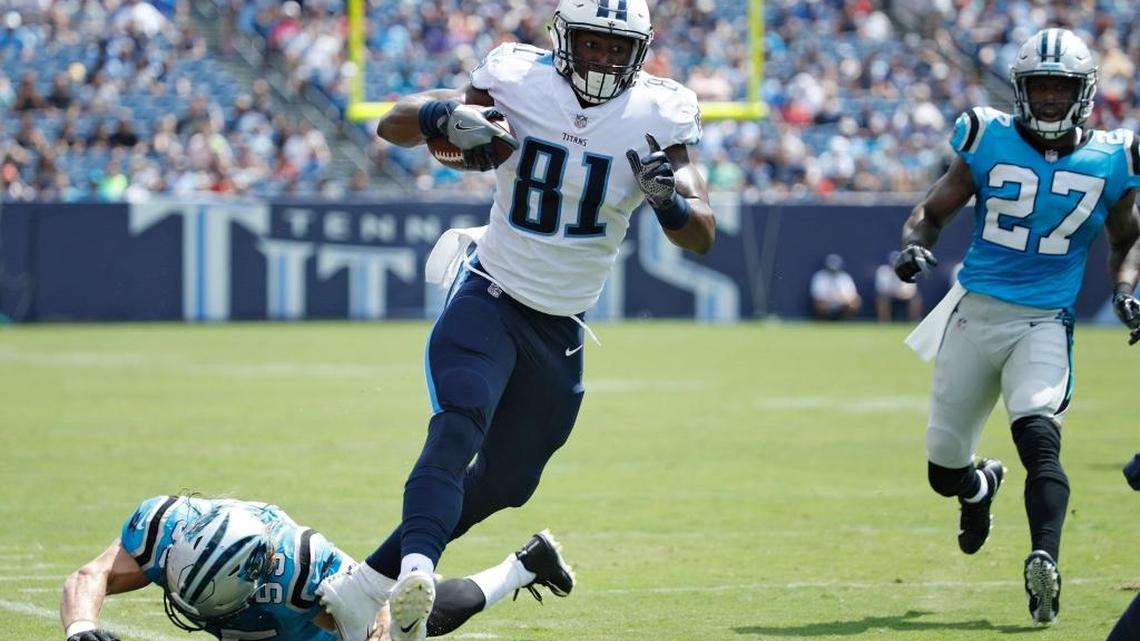 Former FIU tight end Jonnu Smith of Tennessee, No. 81, tries to stay inbounds after a reception in the first quarter of a preseason game against Carolina at Nissan Stadium on Aug. 19.