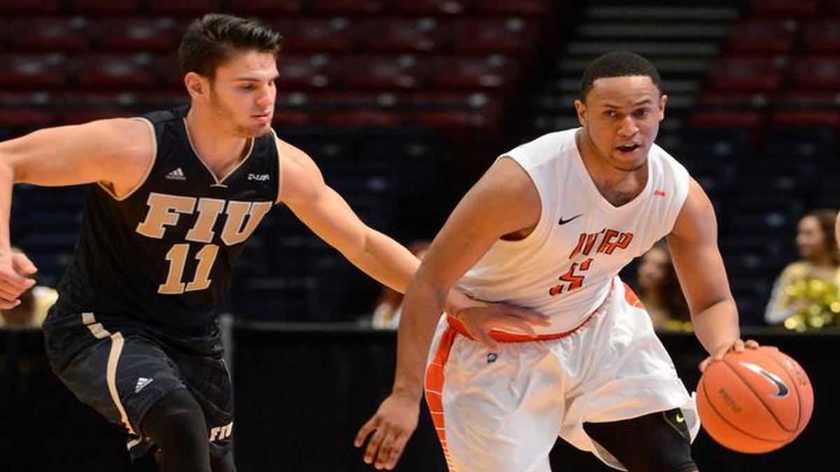 
UTEP’s C.J. Cooper, right, works against the pressure of Florida International’s Ray Rodriquez during the second half of an NCAA college basketball game in the quarterfinals of the Conference USA tournament, Thursday, March 12, 2015, in Birmingham, Ala. 
