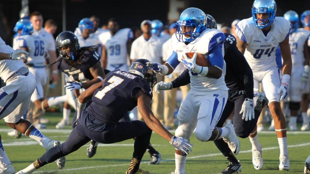 
FIU cornerback Jeremiah McKinnon prepares to tackle Middle Tennessee State’s Jeremiah Bryson.
