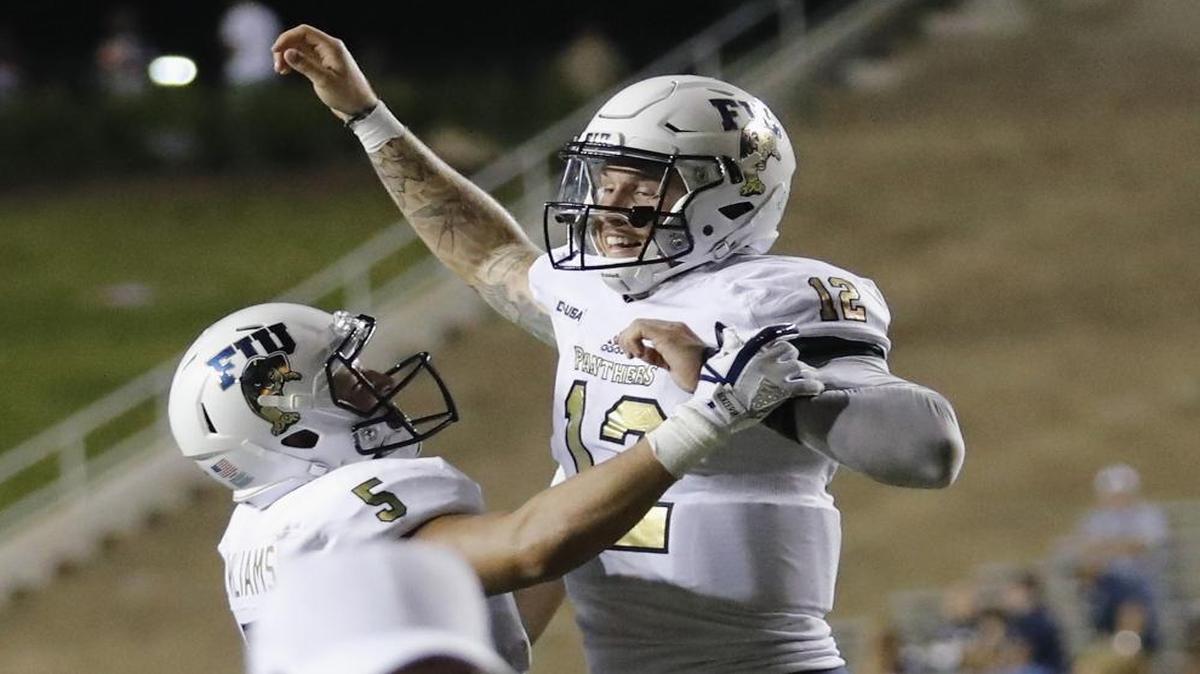 Alex McGough #12 of the FIU Golden Panthers celebrates with Julian Williams #5 after the game against the Rice Owls at Rice Stadium on Sept. 23, 2017 in Houston, Texas.