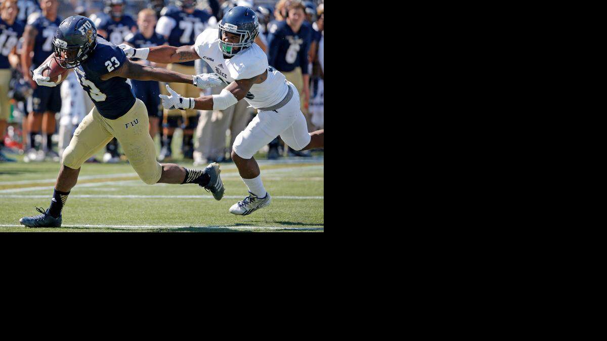 

Making strides: FIU running back Napoleon Maxwell evades Rice’s Jaylon Finner for a touchdown Saturday. He had 88 yards on 16 carries.

