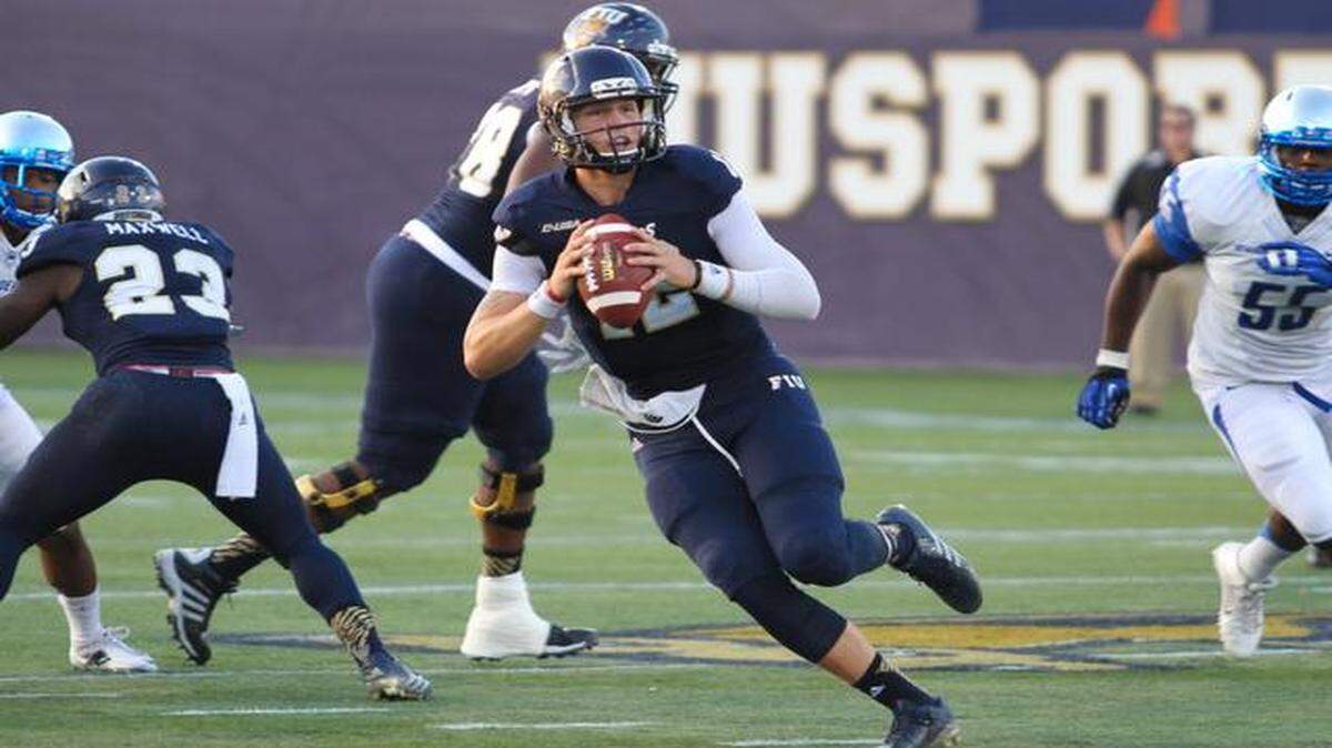 
FIU Quarter back, Alex McGough, looks to make a throw for yardage during the game against Middle Tennessee State University on Saturday.
