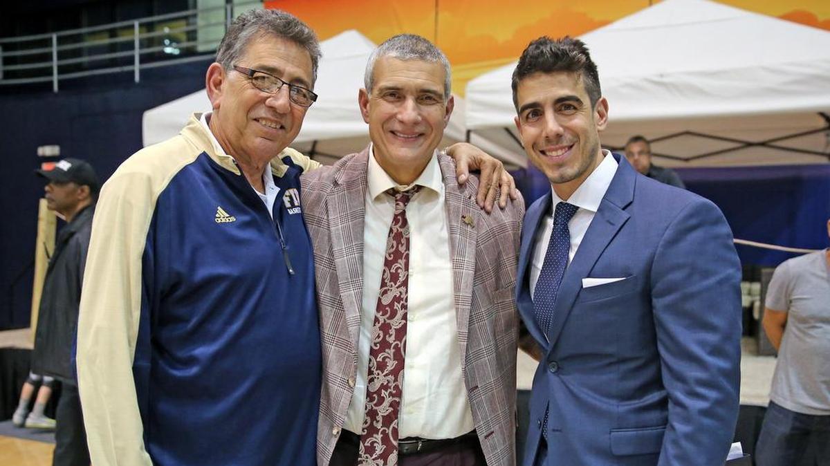 Rafael “Tuna” Oliva and son Mike Oliva, FIU’s director of basketball operations, with South Carolina Gamecocks coach Frank Martin, center, after the FIU Panthers played the Gamecocks in Miami on Monday, Nov. 27, 2017.