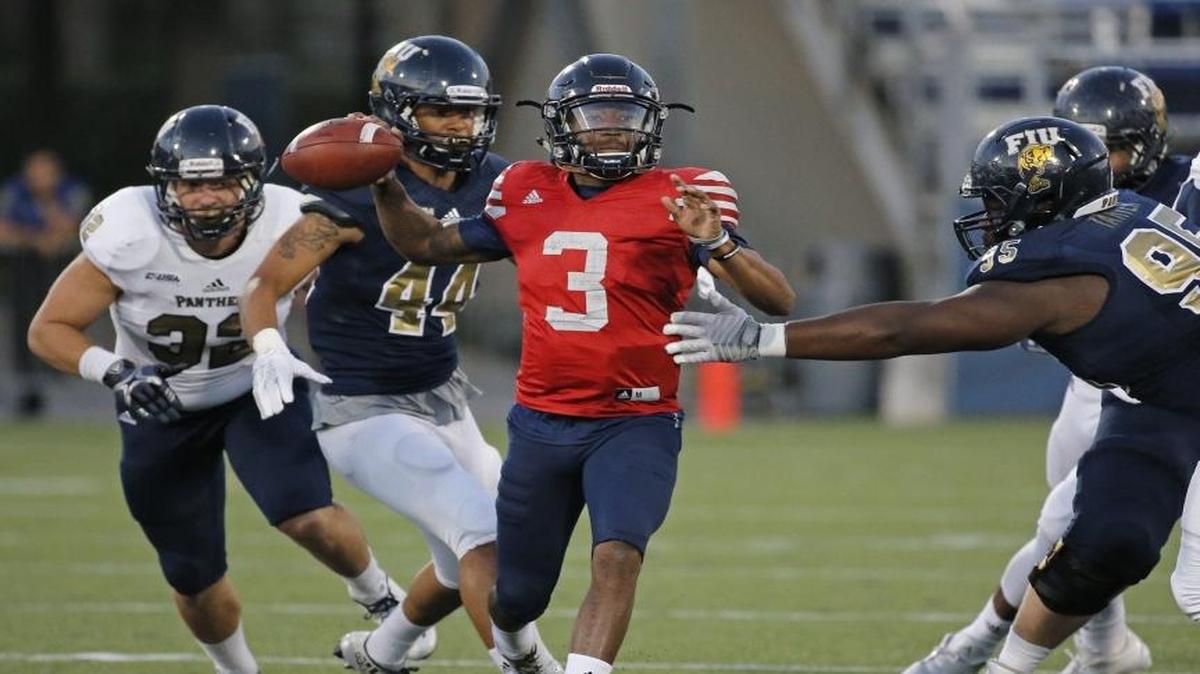 FIU quarterback Maurice Alexander (12) sets up to pass during spring football game at FIU Stadium on April 7, 2017.