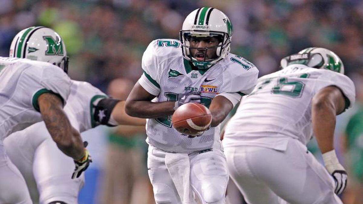 
Marshal's quarterback Rakeem Cato sets up to handoff in the second quarter during Florida International University Panthers vs. Marshall Thundering Herd for the Beef 'O' Brady's Bowl at Tropicana Field in St. Petersburg on Tuesday, December 20, 2011.

