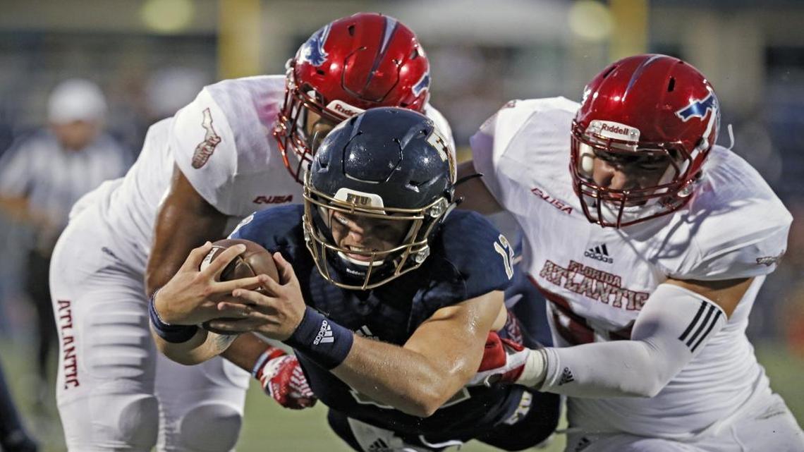 FIU QB Alex McGough scores against FAU.