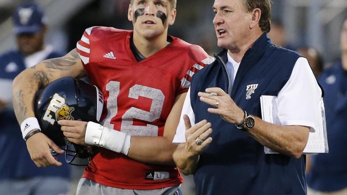 FIU head coach Butch Davis with quarterback Alex McGough (12) during spring football game at FIU Stadium on Friday, April 7, 2017.