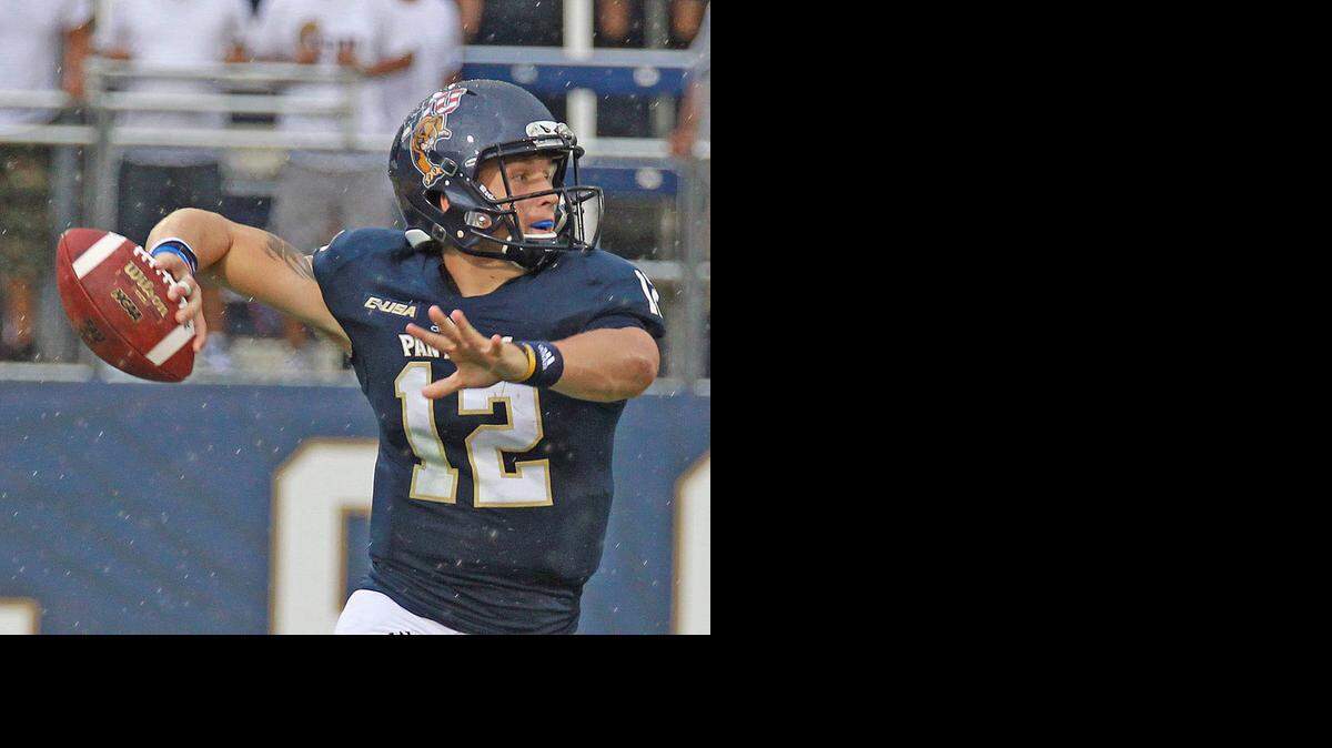 
Rough day: FIU freshman quarterback Alex McGough was 5 of 13 passing for 47 yards, and he was replaced by E.J. Hilliard after sustaining a knee contusion.
