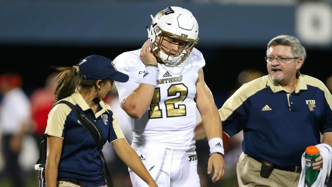 FIU Panthers quarterback Alex McGough walks off the field after being injured on a play against Maryland Terrapins in the first quarter of an NCAA college football game, Friday Sept. 9, 2016, in Miami.