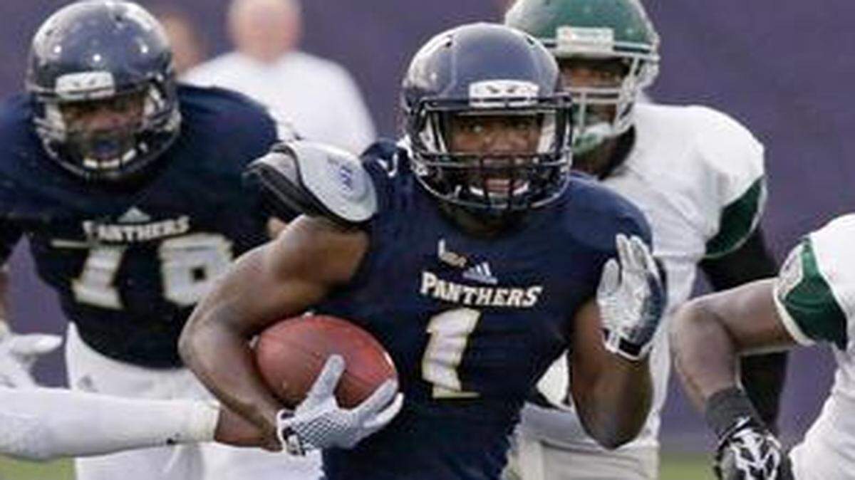 
FIU Panthers’ Alex Gardner (1) controls the ball during the football game against Wagner Saturday, September 6, 2014 at FIU Stadium in Miami.
