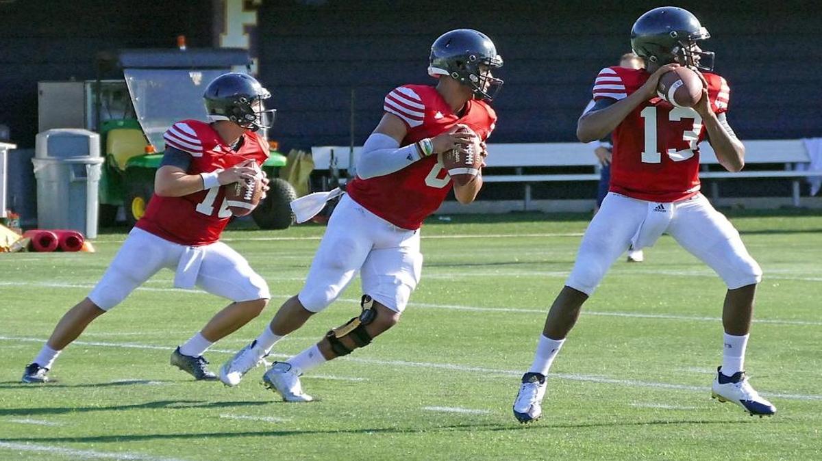 
FIU quarterbacks Trey Anderson, Christian Alexander and Maurice Alexander go through drills during practice Monday, Aug. 10, 2015.
