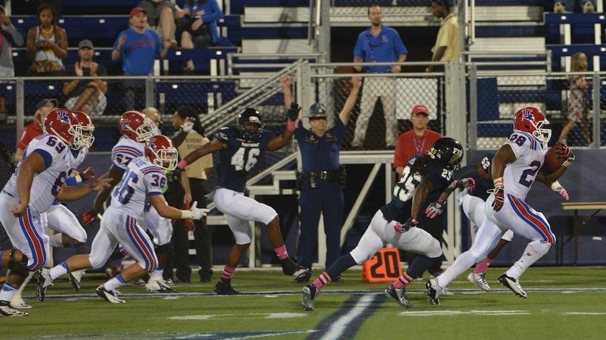 
Kenneth Dixon of Louisiana Tech scores a touchdown against FIU on Saturday, Oct. 26, 2013 at FIU Stadium. 
