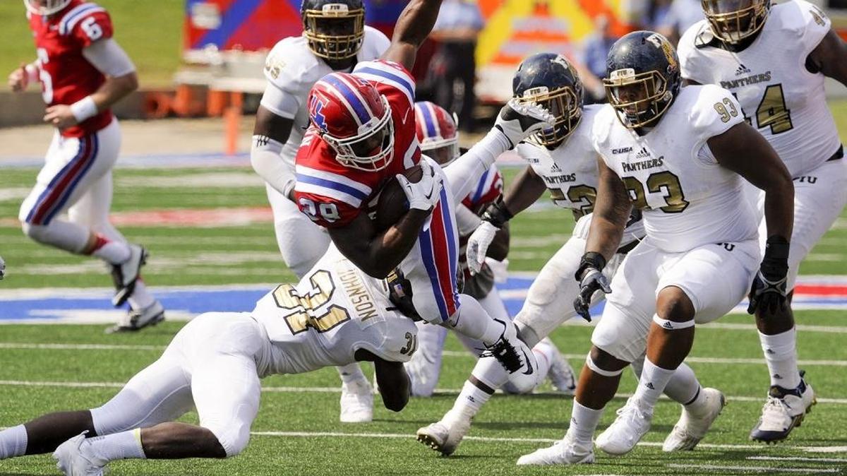 Louisiana Tech running back Kenneth Dixon gains yardage against FIU on Saturday, Sept. 26, 2015.