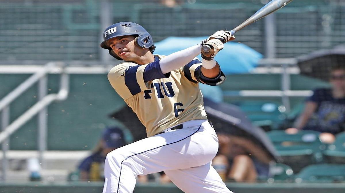 
FIU infielder Eddie Silva (6) hits a single in the seventh inning as Florida International University Panthers hosts the East Carolina Pirates at Mark Light Field at Alex Rodriguez Park in Coral Gables on Saturday, May 30, 2015.
