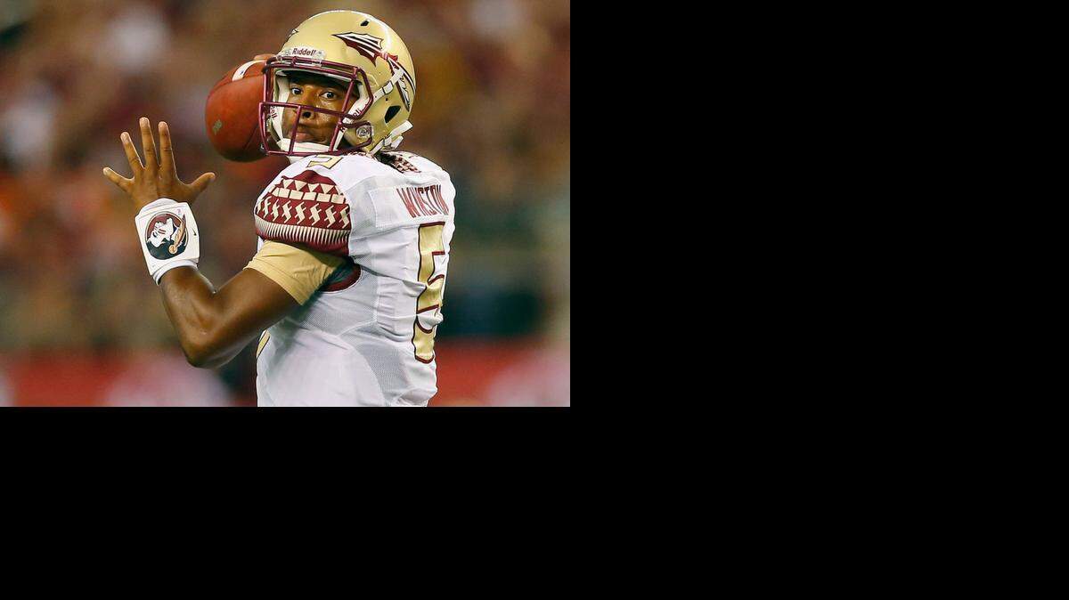 
Jameis Winston #5 of the Florida State Seminoles passes against the Oklahoma State Cowboys in the first half of the Advocare Cowboys Classic at AT&T Stadium on Aug. 30, 2014 in Arlington, Texas.
