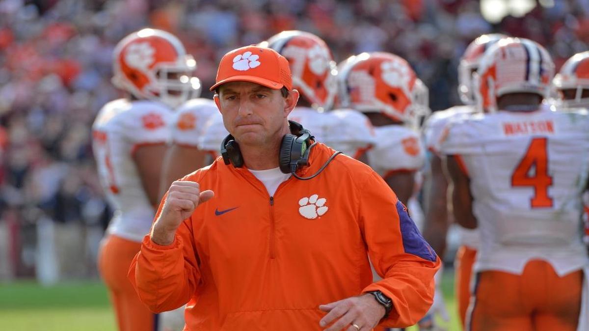 FILE - In this Nov. 28, 2015, file photo, Clemson head coach Dabo Swinney reacts in the closing minutes of an NCAA college football game against South Carolina in Columbia, S.C. Swinney grew up in near Birmingham, and like so many boys his age, dreamed of playing football for the University of Alabama and coach Bear Bryant. He fulfilled part of that dream.