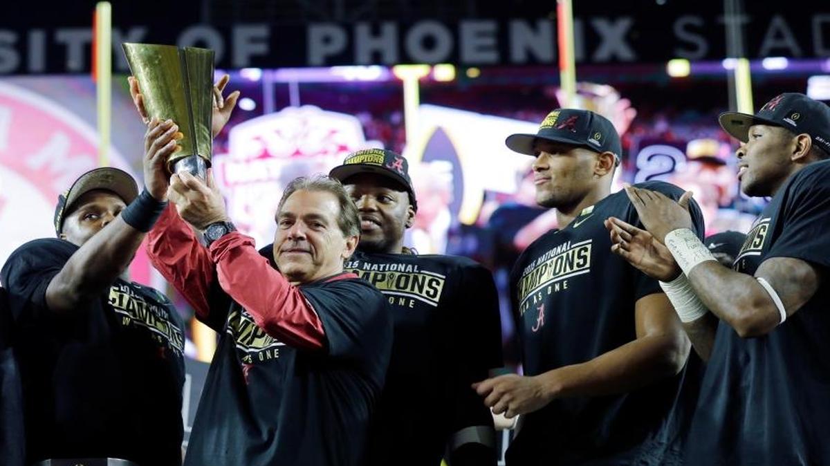 Alabama head coach Nick Saban and players celebrate after the NCAA college football playoff championship game against Clemson Mon., Jan. 11, 2016, in Glendale, Ariz. Alabama won 45-40.