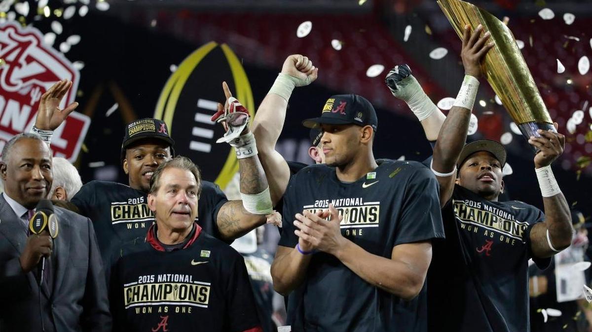 Alabama coach Nick Saban, left, celebrates with his players after beating Clemson late Monday night in the College Football Playoff championship game in Glendale, Ariz., thanks in large part to an onside kick five minutes into the fourth quarter.