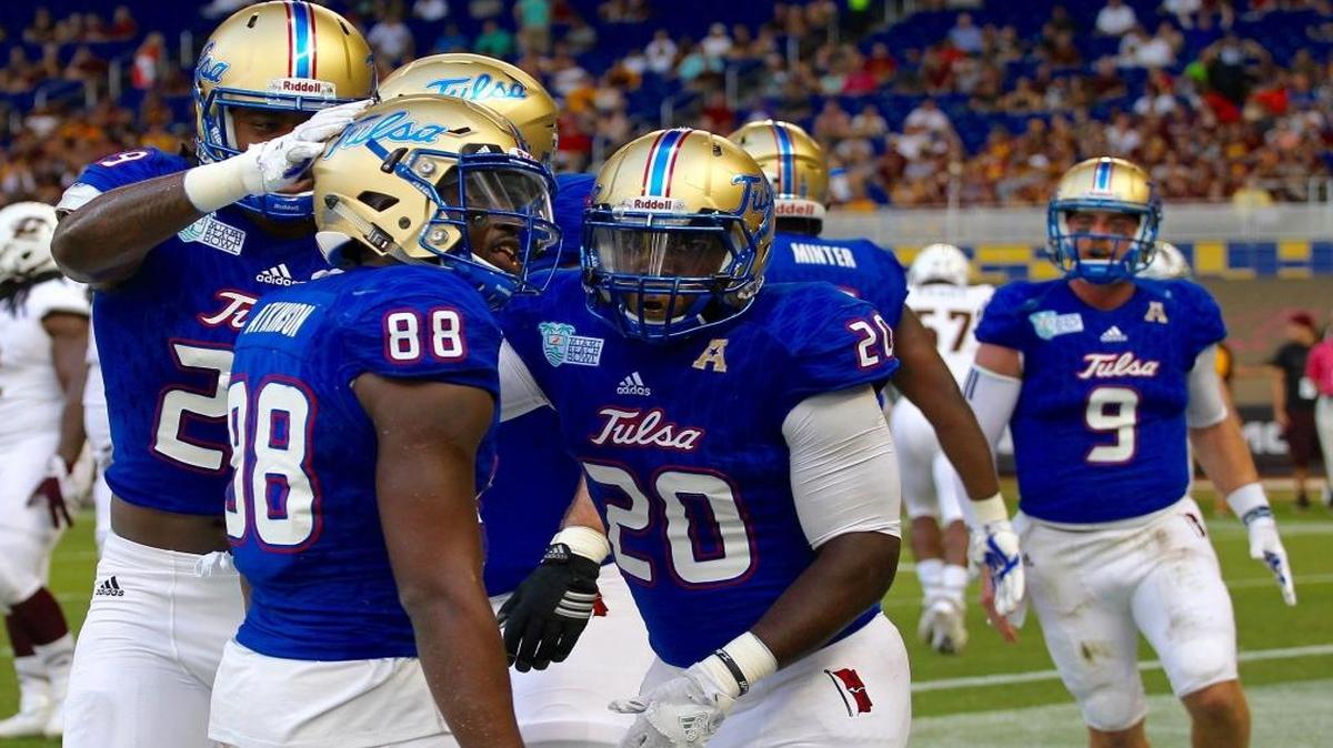 Tulsa wide receiver Josh Atkinson, center, celebrates in the end zone after his touchdown in the first half. Tulsa played against Central Michigan on Mon., Dec. 19, 2016 during the Miami Beach Bowl at Marlins Park in Miami, Florida.