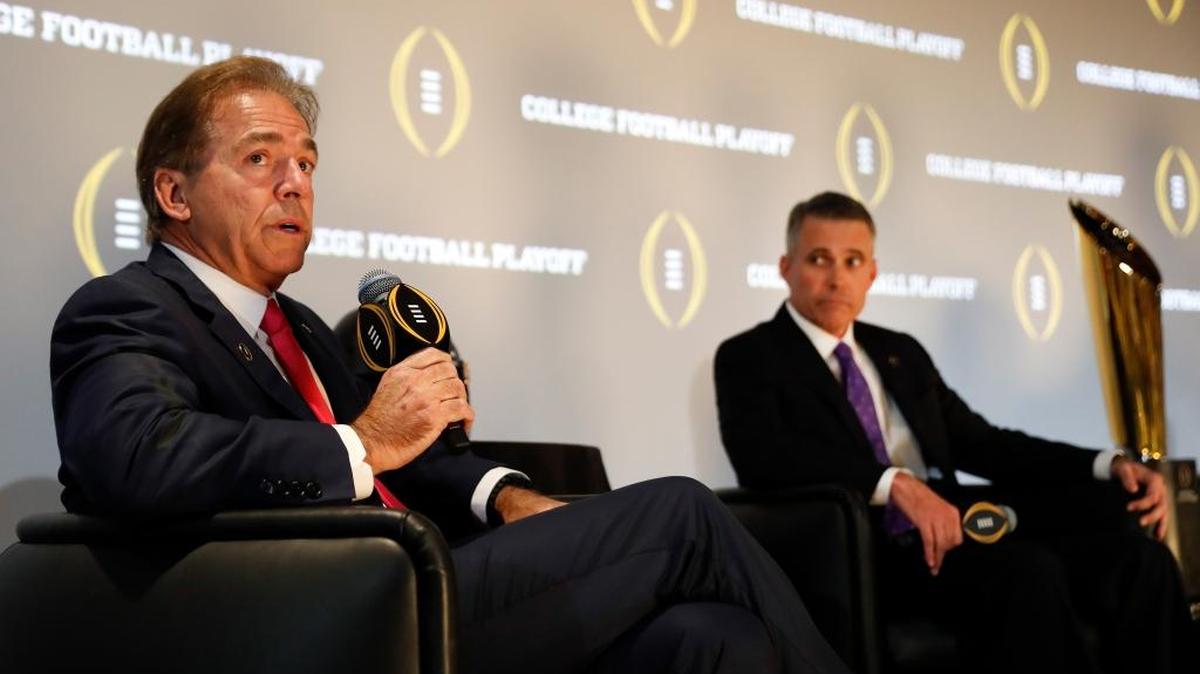 Alabama head coach Nick Saban speaks as Washington coach Chris Petersen looks on during a Peach Bowl news conference on December 8. Alabama and Washington will face off in playoff game.
