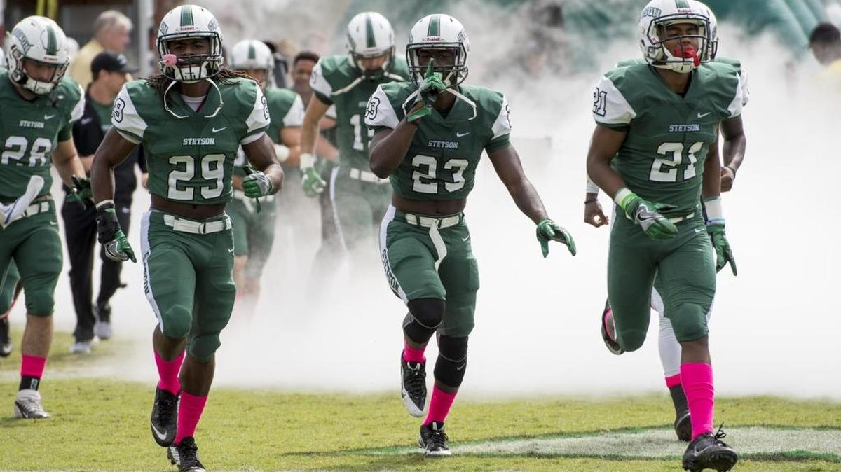 Stetson football players take the field in DeLand during the 2016 season.