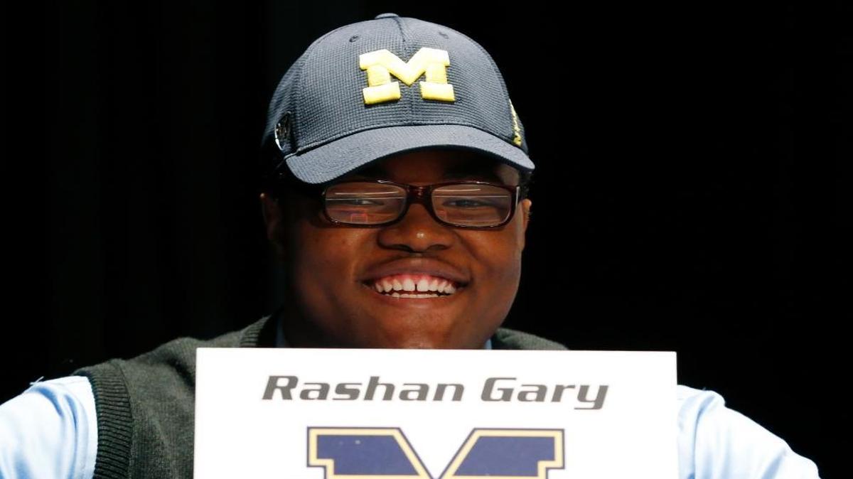 Paramus Catholic High School defensive tackle Rashan Gary, a top high school football recruit, smiles during a school rally following the TV announcement in which he declare he intends on playing college football at Michigan on National Signing Day, Wednesday, Feb. 3, 2016, in Paramus, N.J.