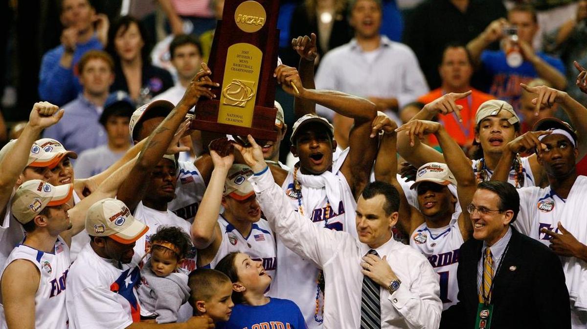 Head coach Billy Donovan and his Florida Gators celebrate with the trophy after defeating the Ohio State Buckeyes during the NCAA Men's Basketball Championship game at the Georgia Dome on April 2, 2007 in Atlanta, Georgia.