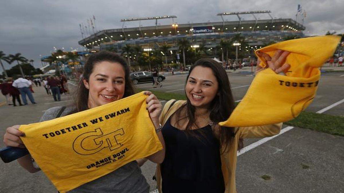 
 Georgia Tech fans Ivana Gonzalez and Annalury Villasante show their support as they arrive at Sun Life Stadium on Wednesday ahead of their team’s matchup with Mississippi State.
