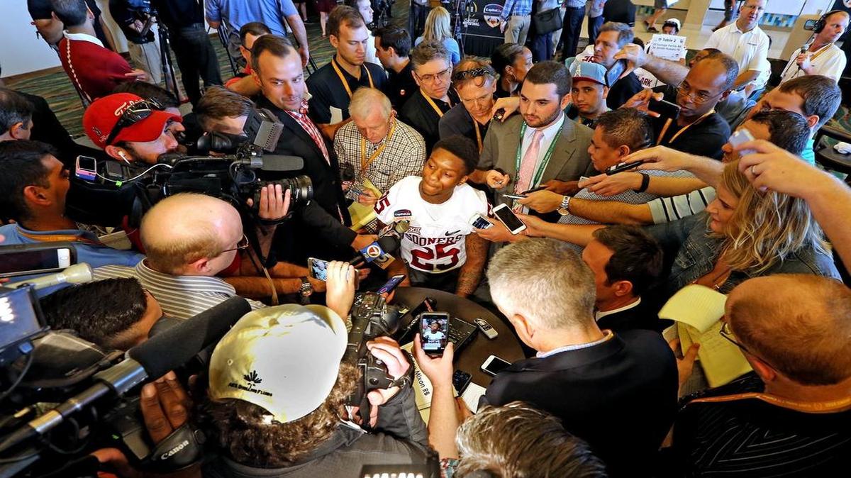 Joe Mixon is surrounded by media members anxious to hear his thoughts about the suspension that cost him all of 2014.