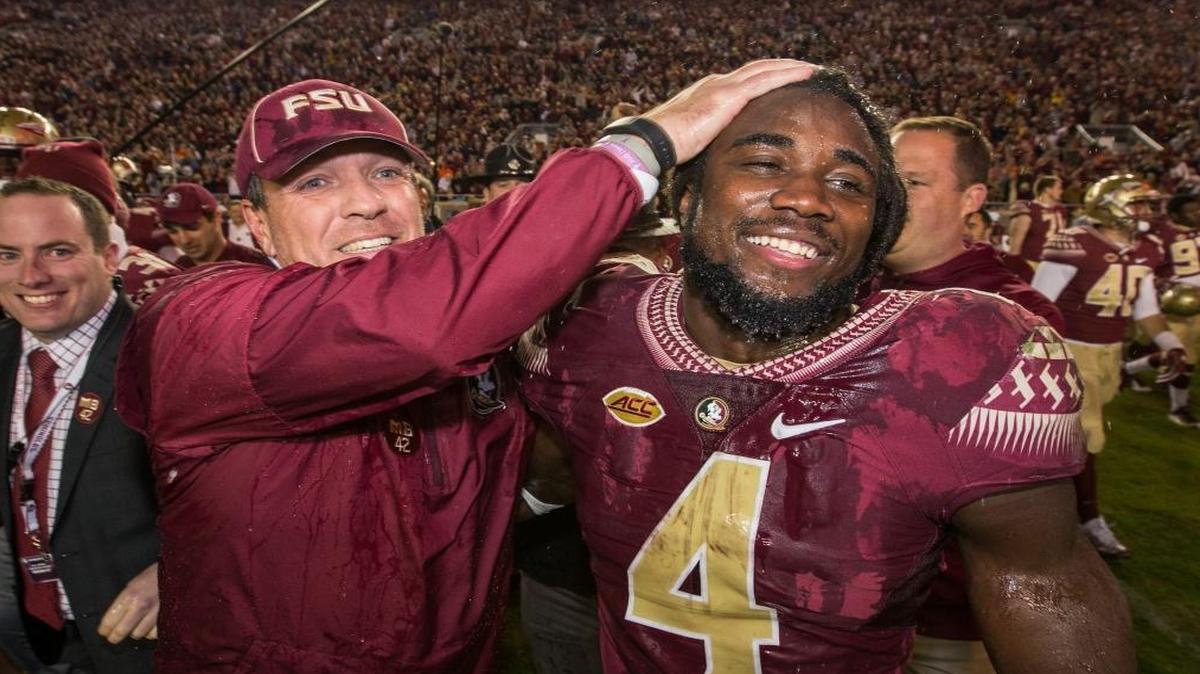 Florida State coach Jimbo Fisher and running back Dalvin Cook celebrate the team's 31-13 win over Florida in an NCAA college football game in Tallahassee, Fla., Saturday, Nov. 26, 2016.