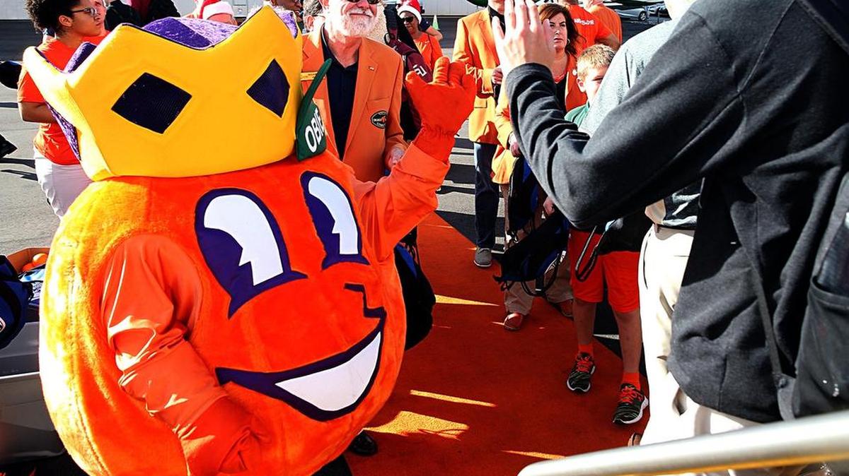 OBE, the mascot of the Orange Bowl, welcomes last year’s teams on Dec. 24, 2016.