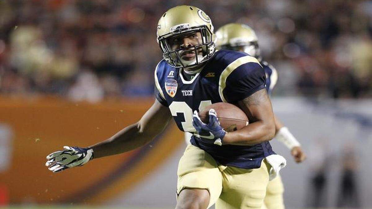 
Georgia Tech Yellow Jackets running back Deon Hill (31) runs for a first down in the first quarter. Mississippi State vs Georgia Tech at the 2014 Orange Bowl Game at Sun Life Stadium on Wednesday, December 31, 2014.
