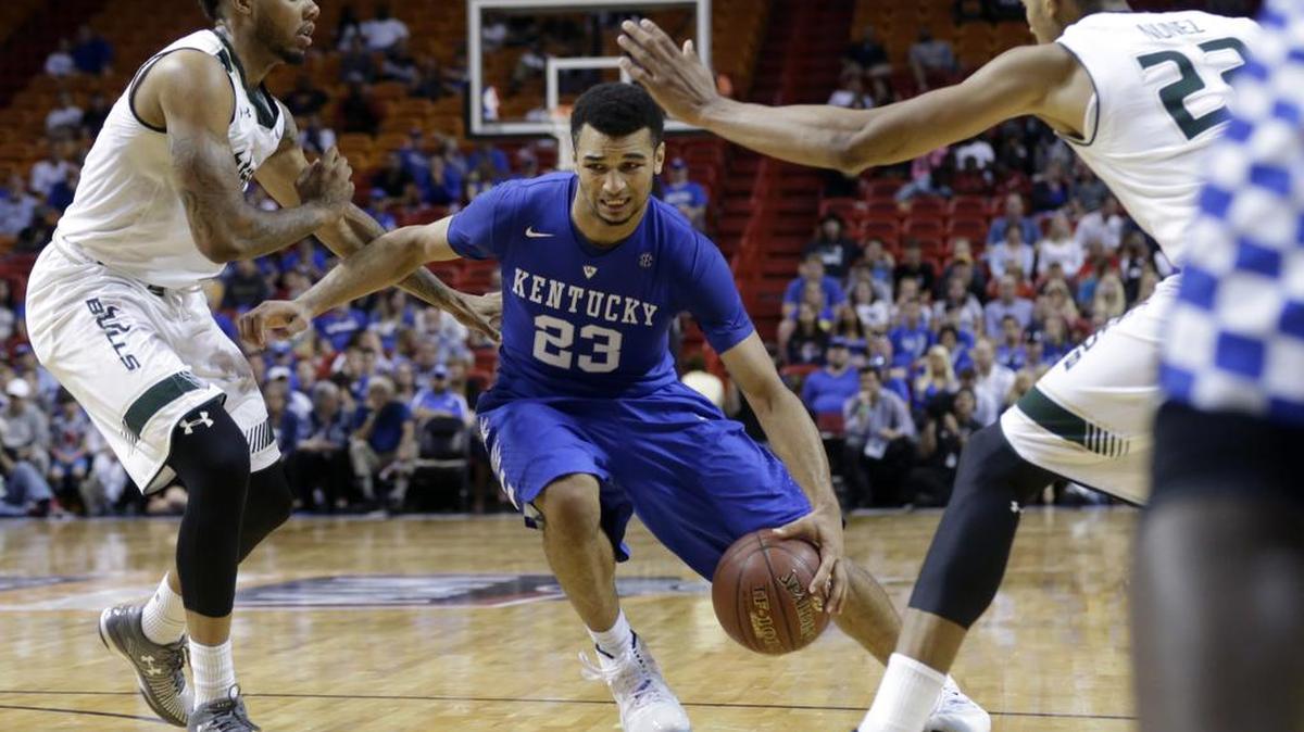 Kentucky guard Jamal Murray (23) drives to the basket as South Florida guard Roddy Peters, left, and forward Angel Nunez, right, defend in the second half of the Hoophall Miami Invitational, Friday, Nov. 27, 2015, in Miami.